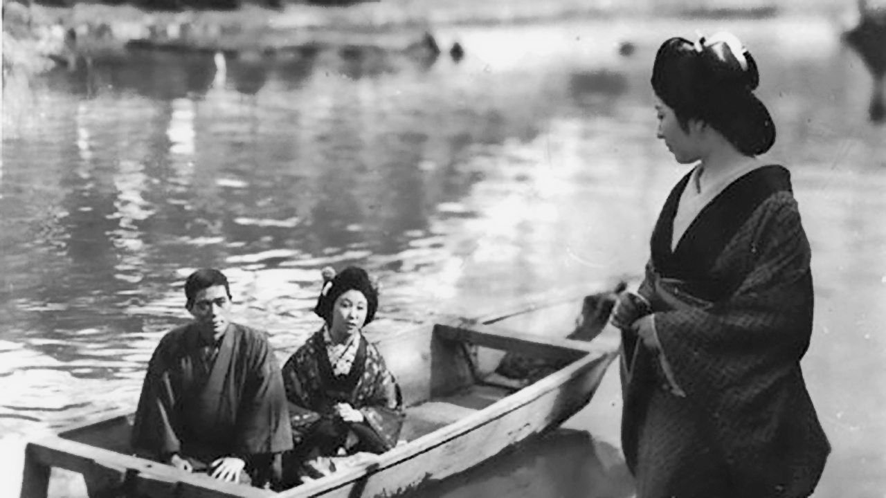 man and woman in row boat looking at woman on shore