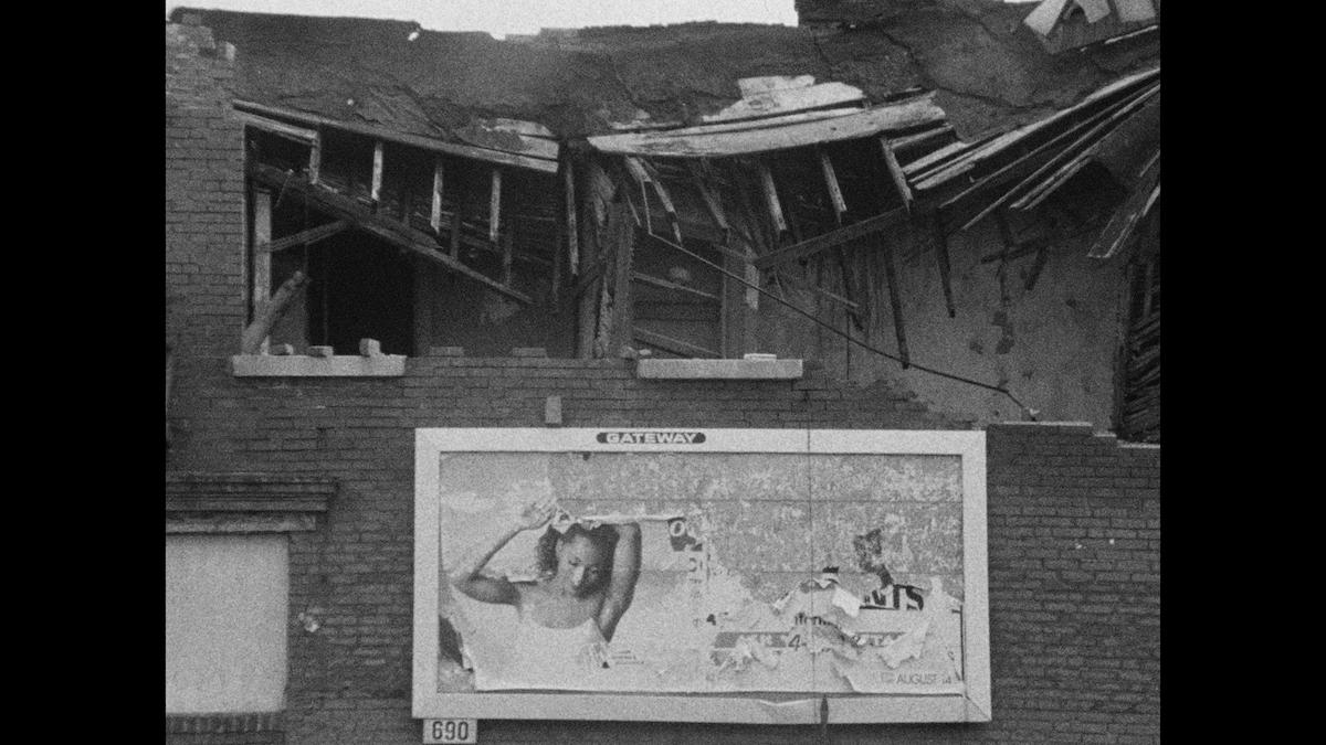 dilapidated building with billboard