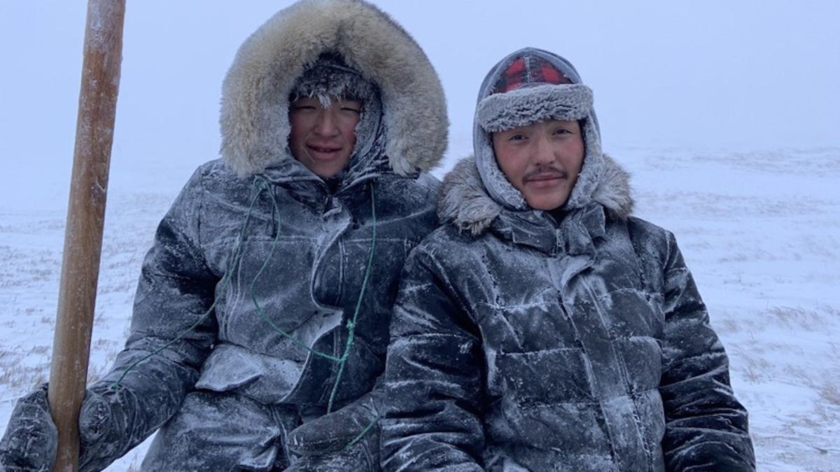 two eskimos in snow
