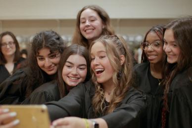 group of teenage girls taking selfie