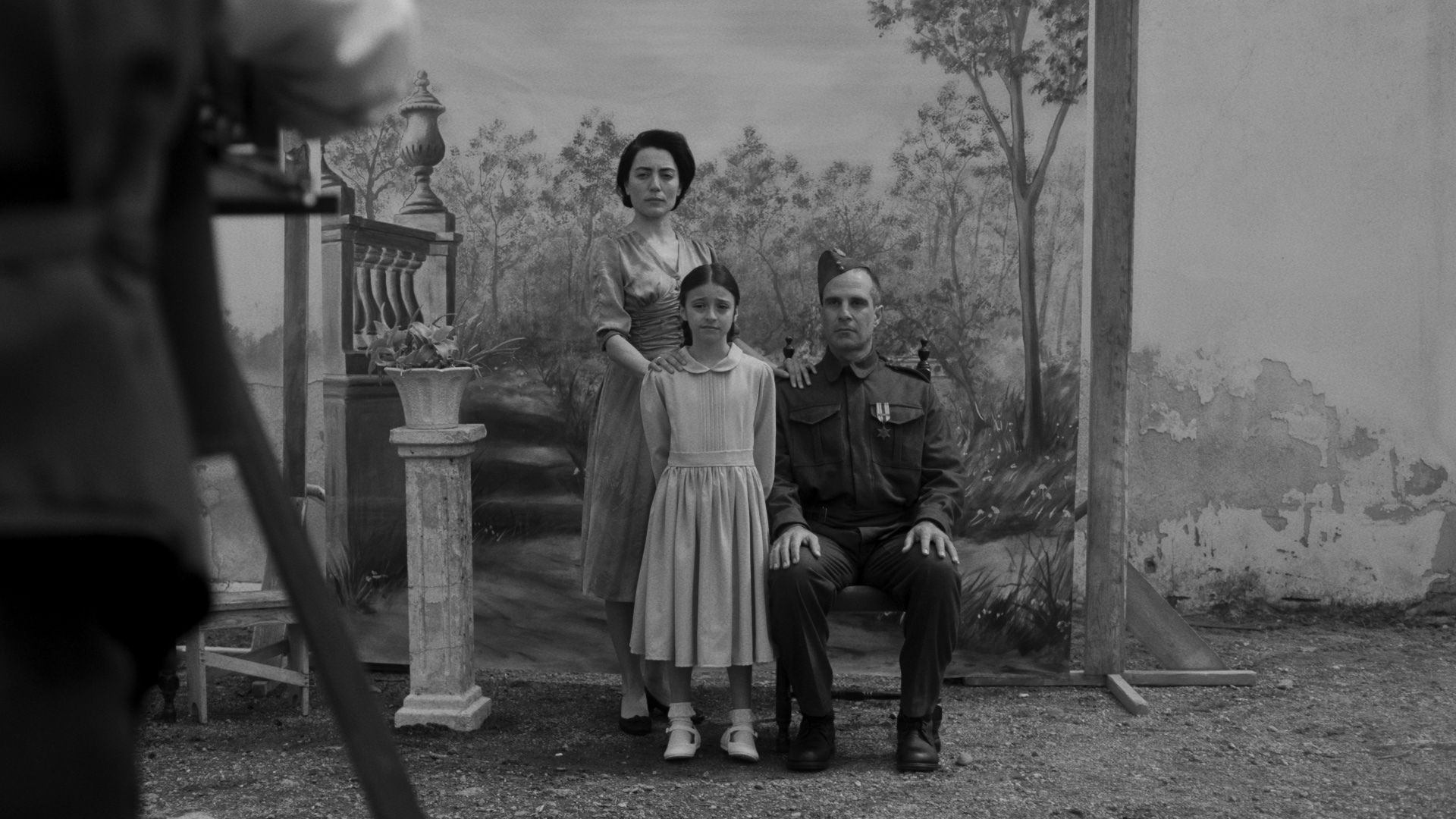 AFRICA STAR, 2024, black and white image of family posing for portrait with mother and daughter in formalwear and father in uniform