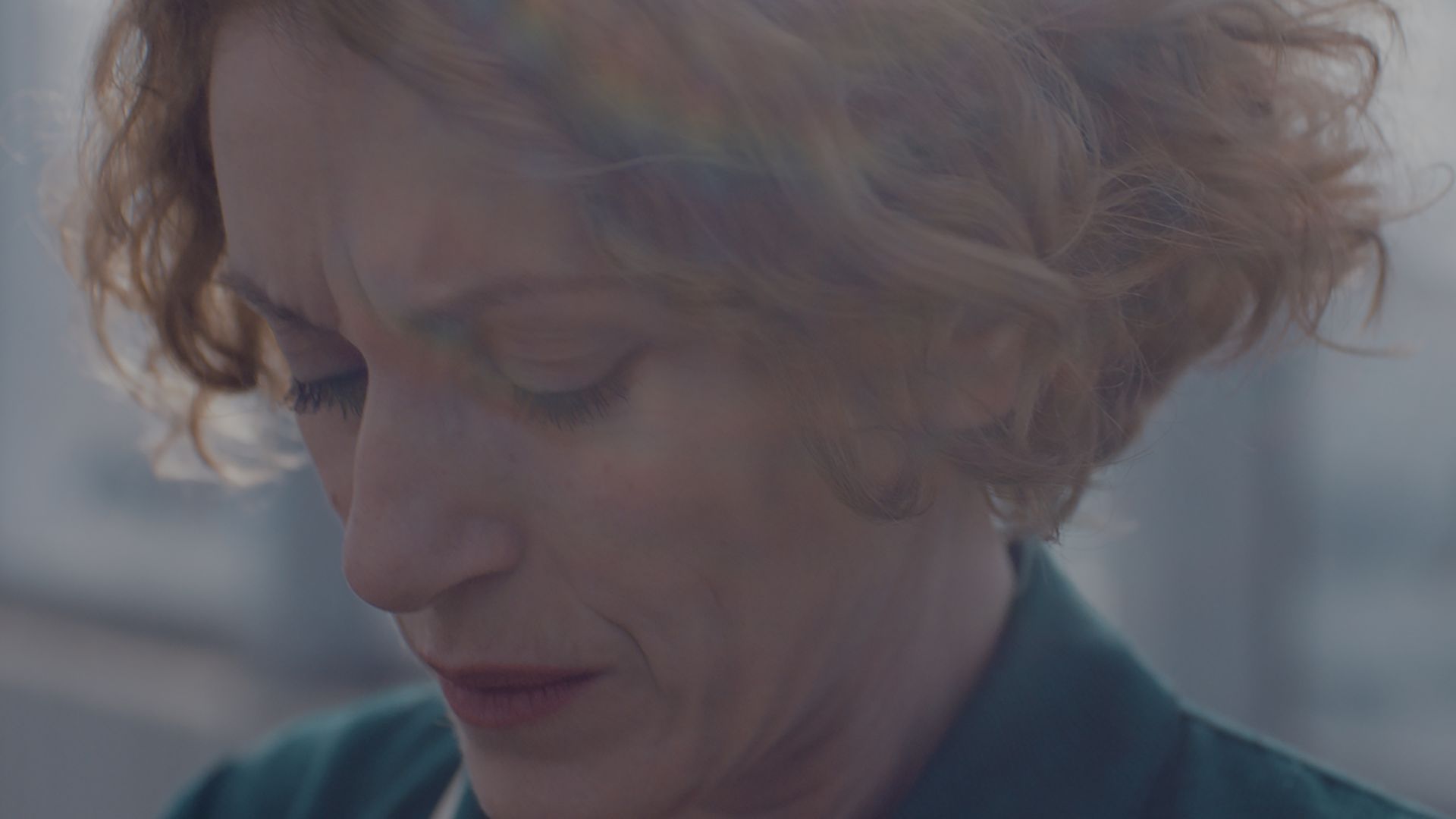 PAUSE, 2018, closeup of woman looking down