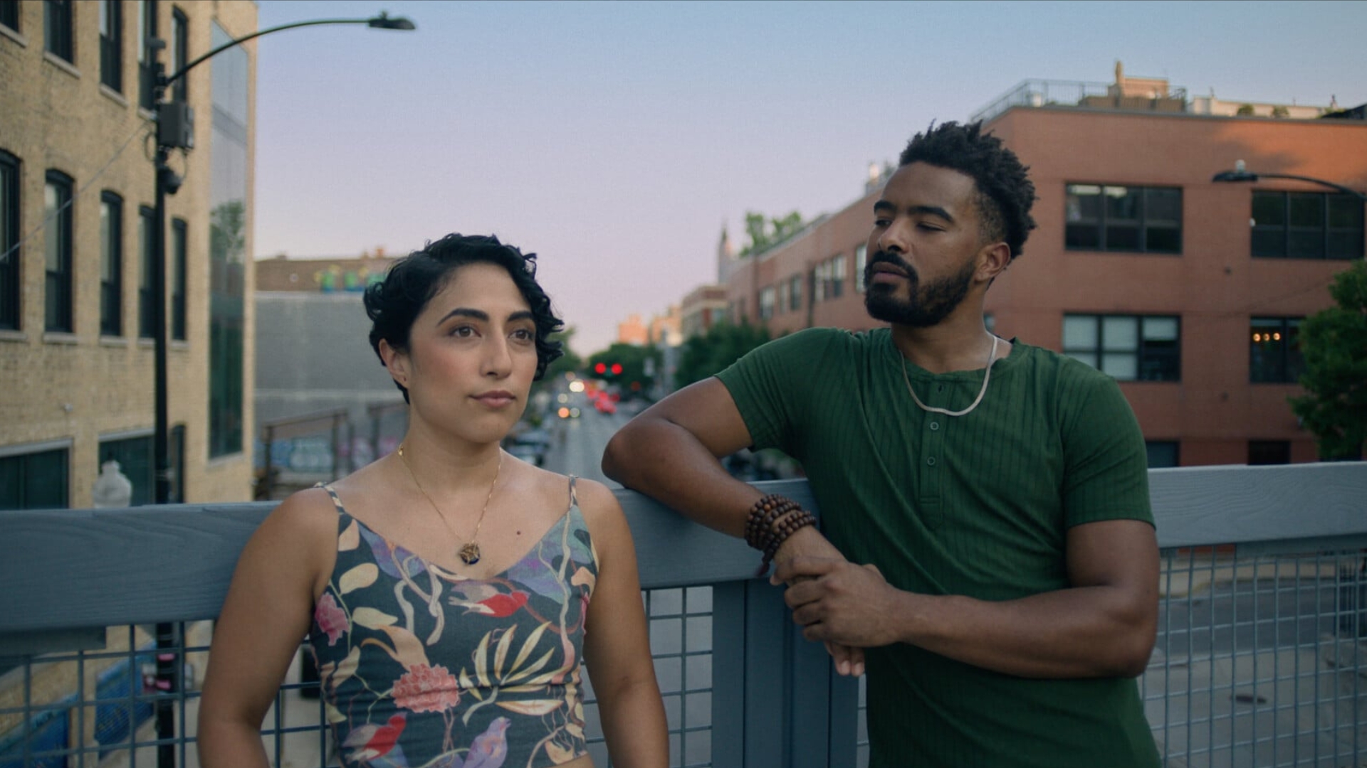ANOTHER VERSION OF ME: AAPI CHICAGO SHORTS, 2024–26, man and woman standing on balcony outside