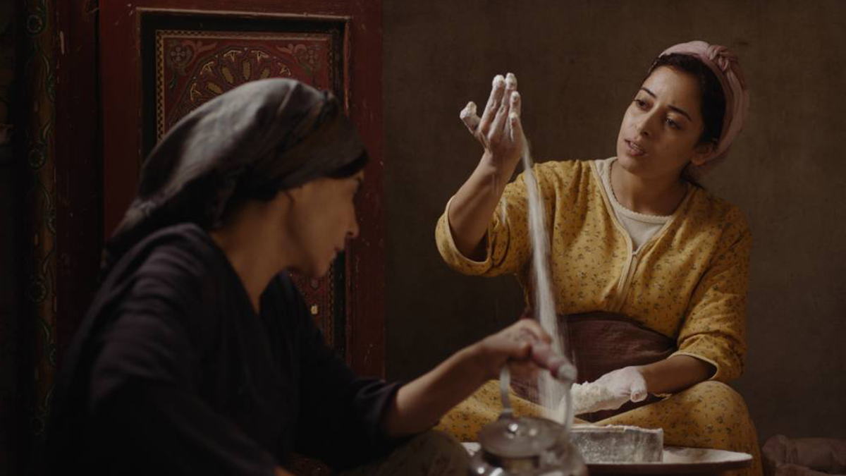 Two people working with flour