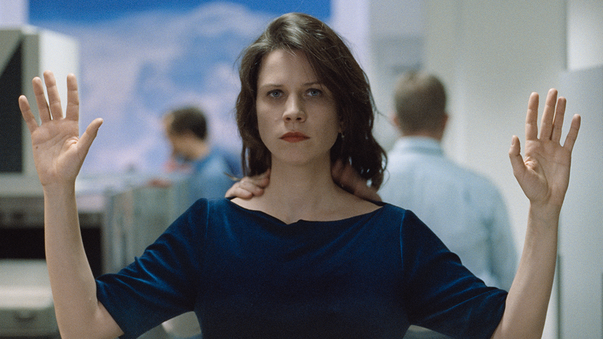 Person holding both hands up