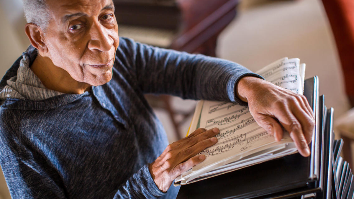 person holding manuscript