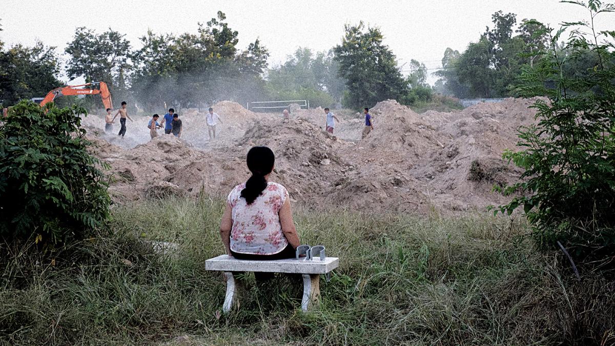 woman sitting on bench outside
