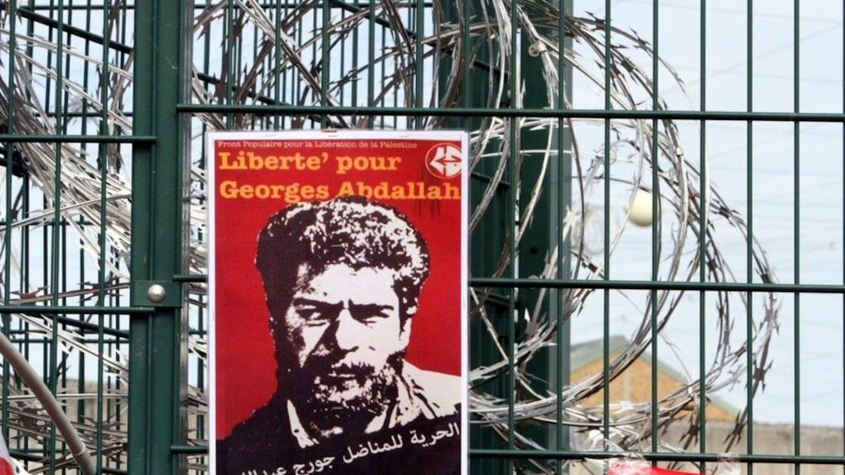 poster on barbed wire fence