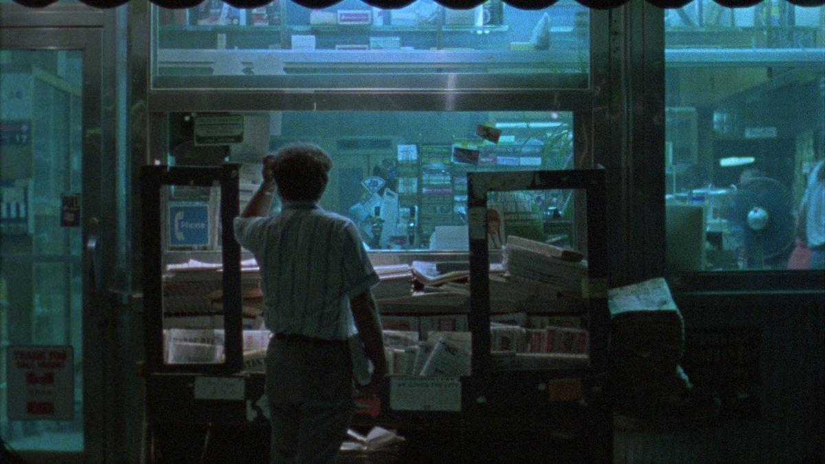 man standing at office window