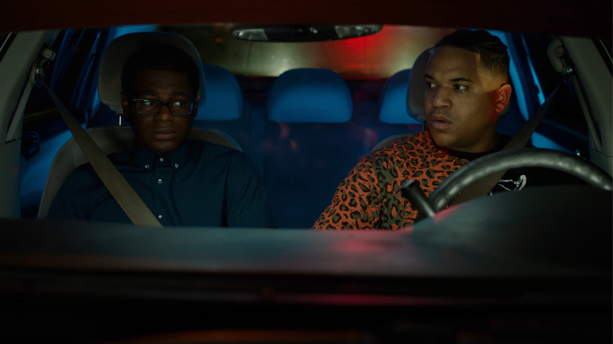 two people sitting in car at night