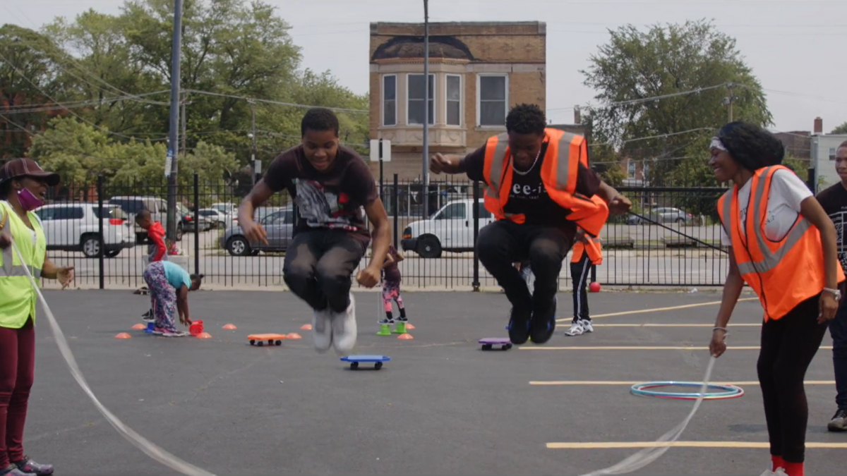people jump roping in parking lot