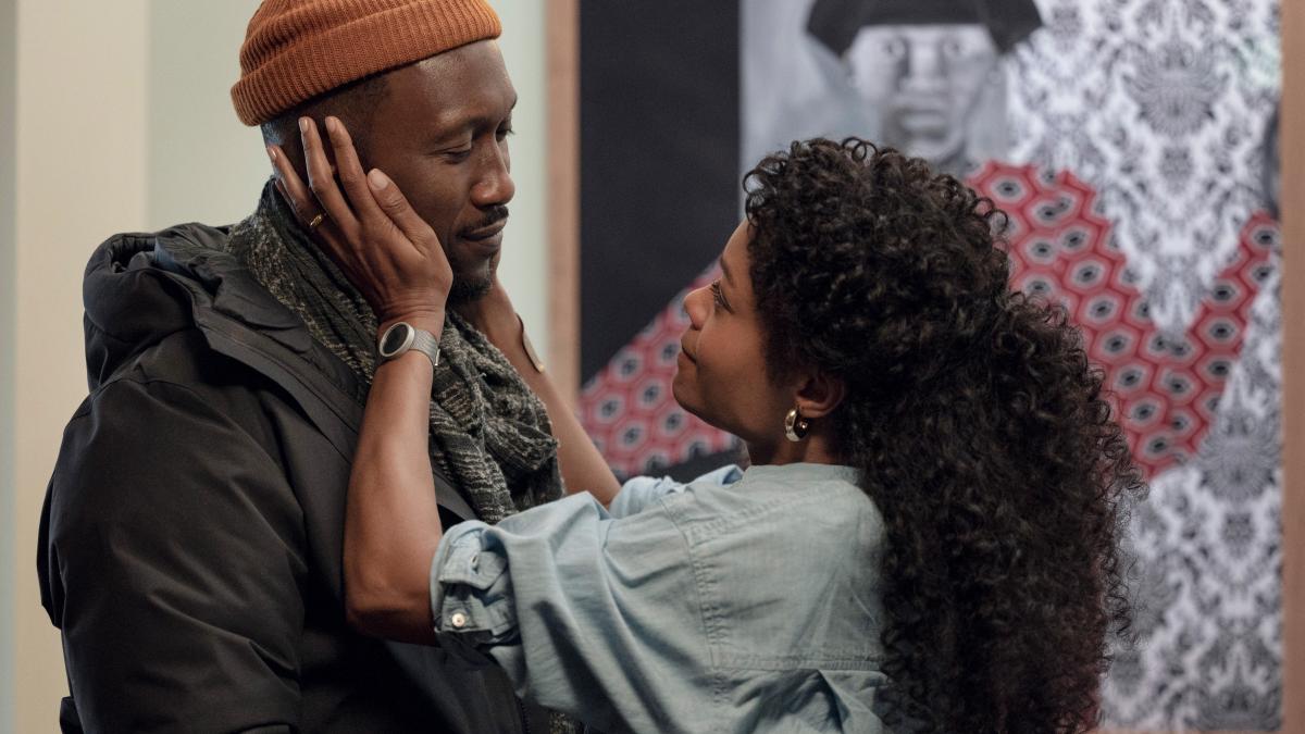 woman holding mans face affectionately