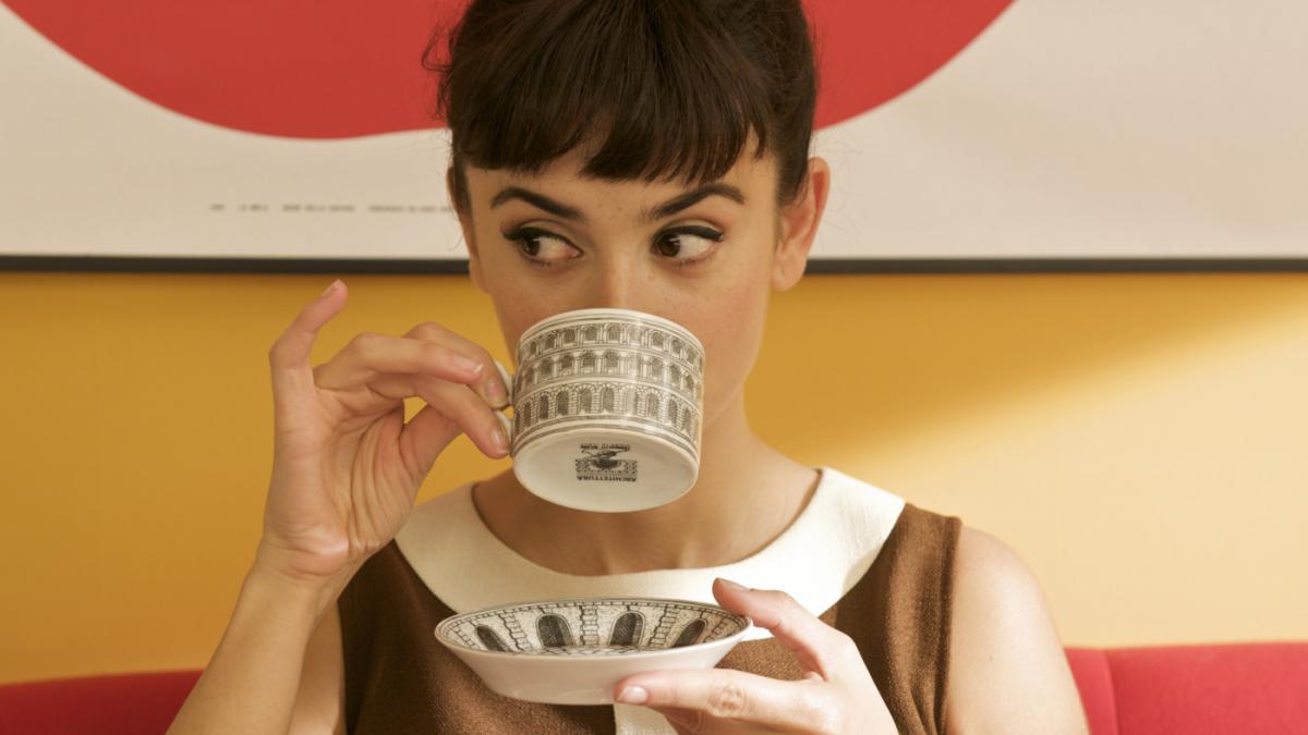 women sipping from tea cup