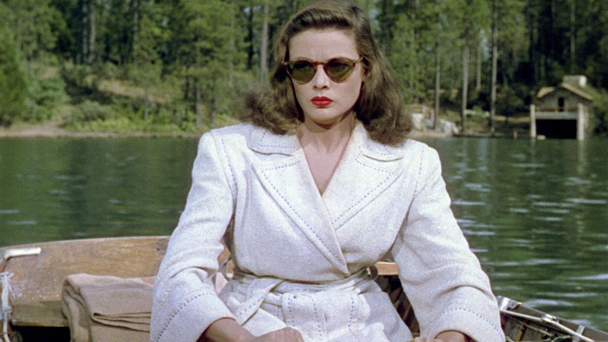 woman wearing sunglasses on rowboat