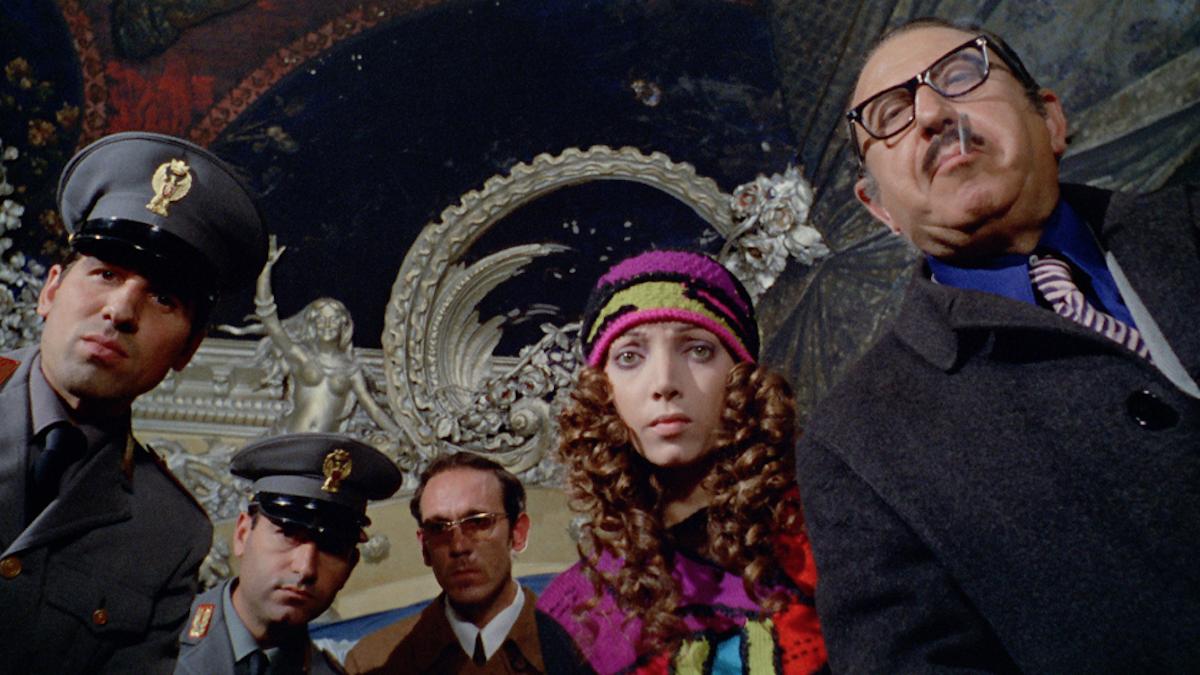 people staring downwards in a semi circle