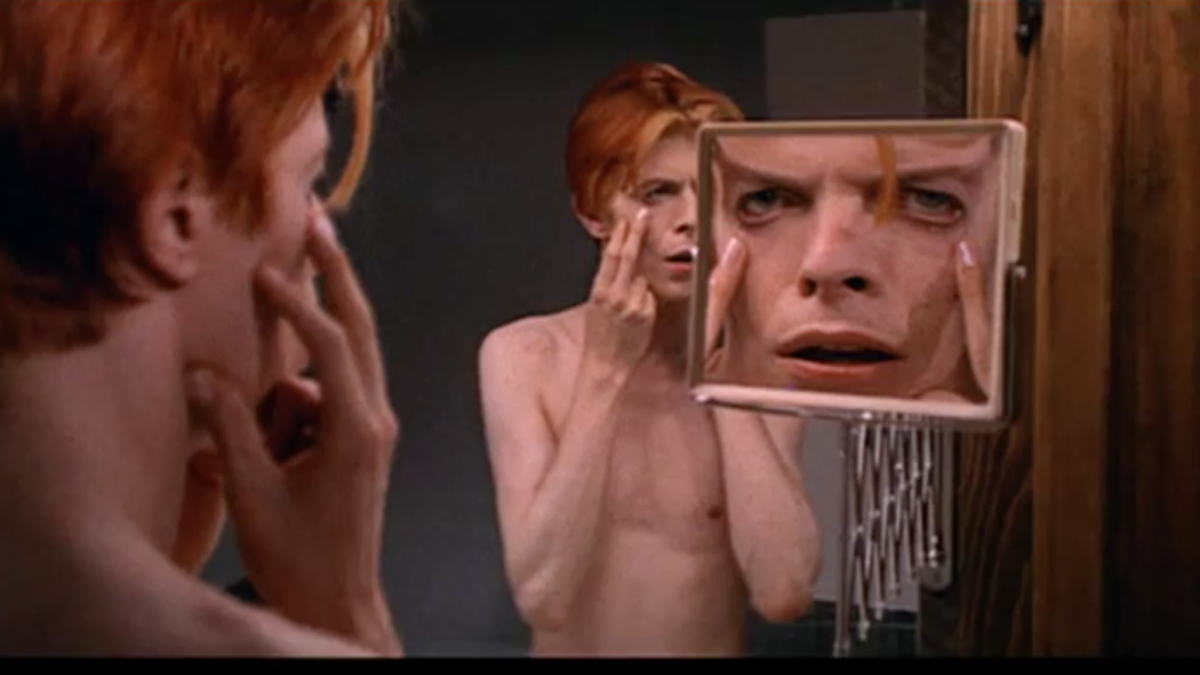 man looking in mirror