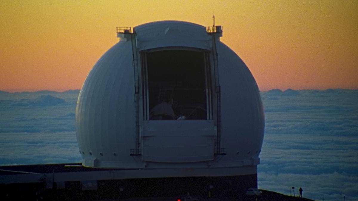 large sphere near the ocean sunset