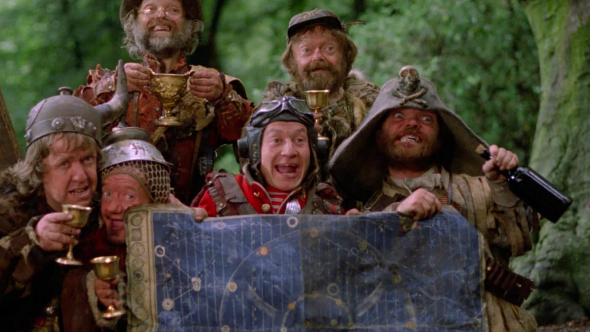 medieval men in forest holding map