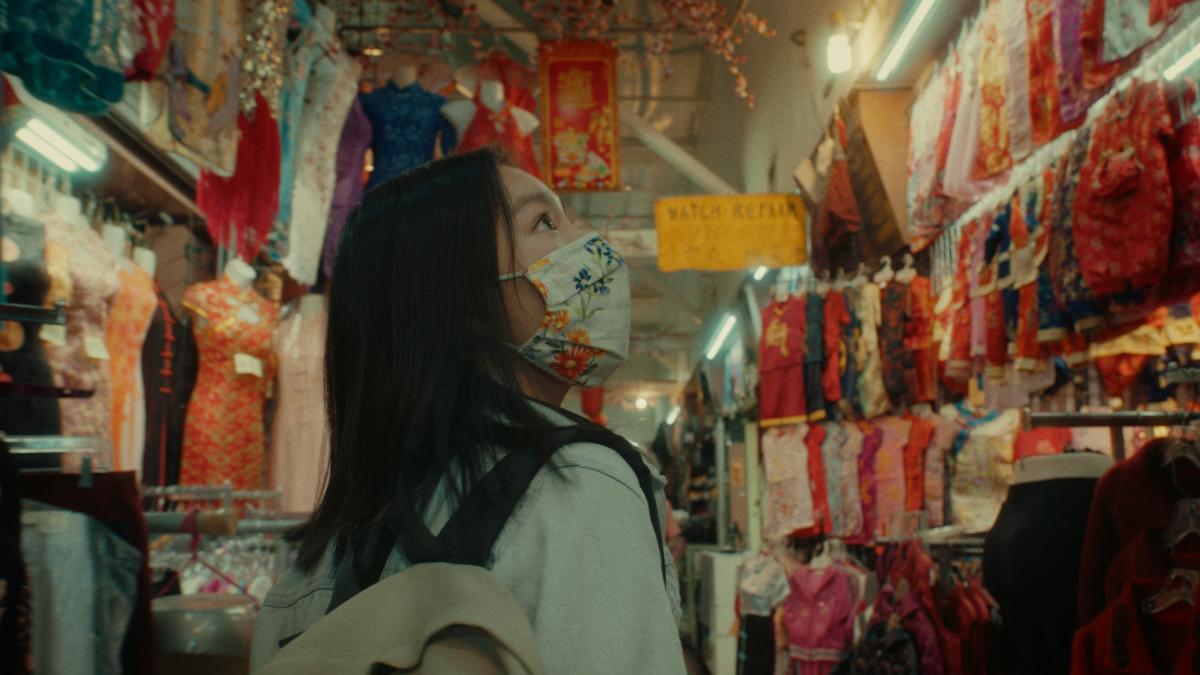 back of woman's head shopping in store