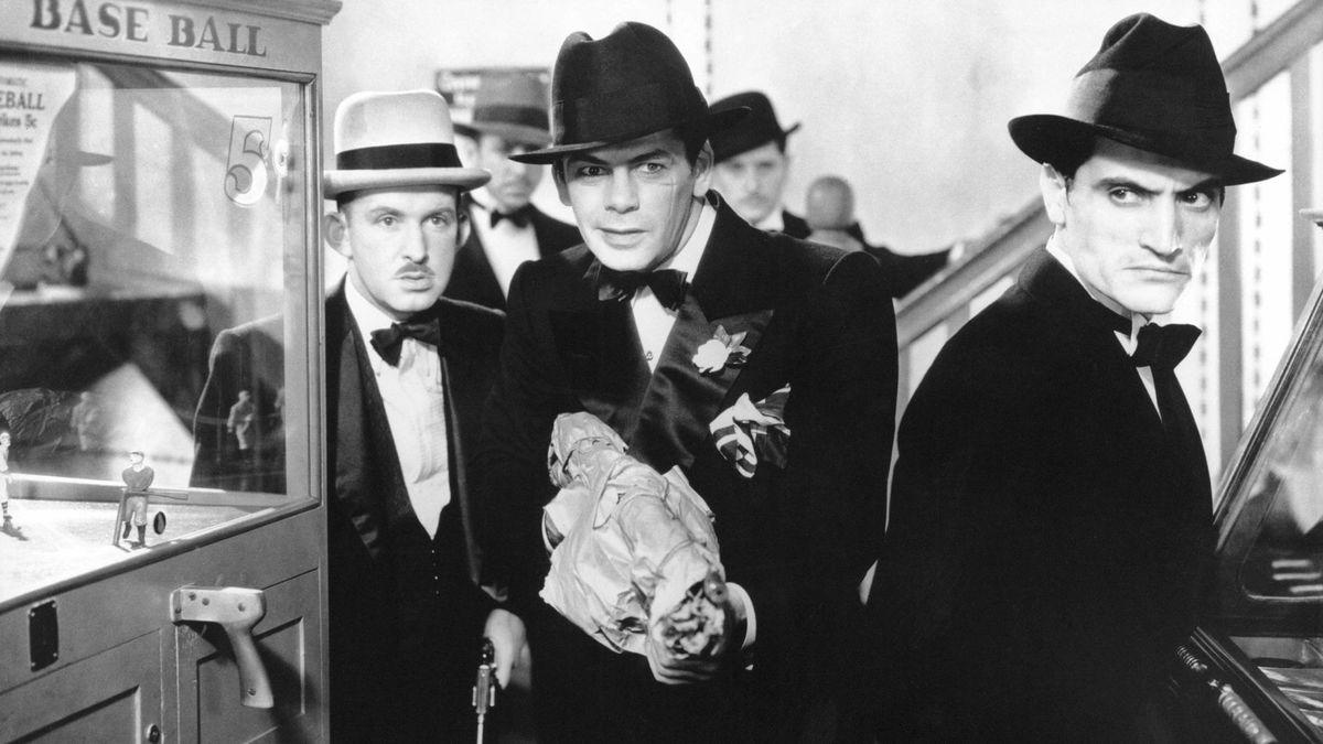 three men in hats and suits entering room