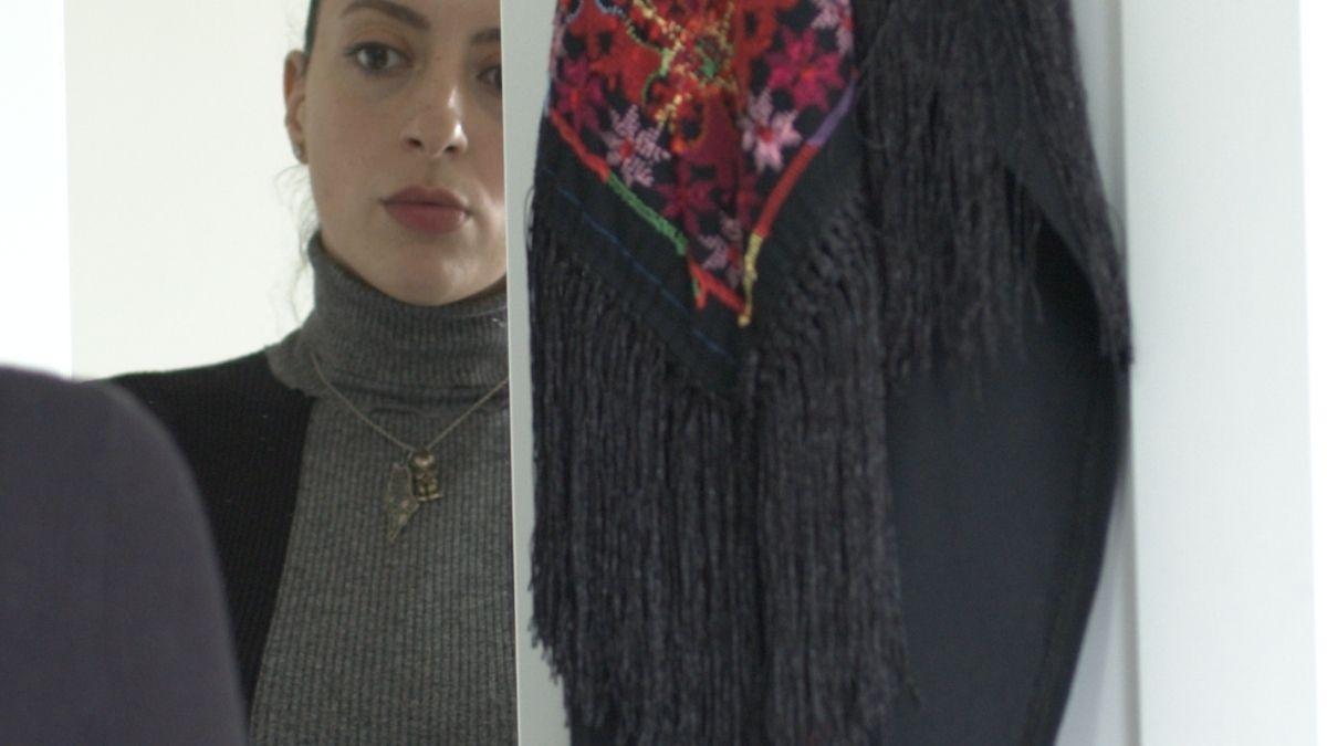 woman looking in mirror