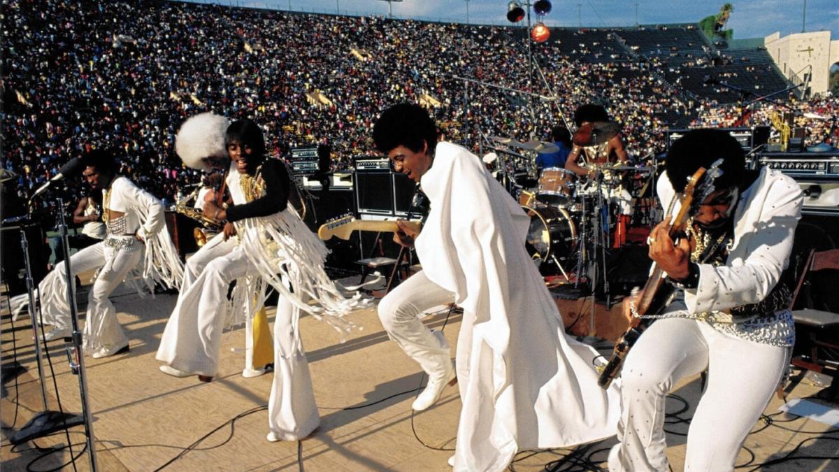 band performing on stage in matching outfits