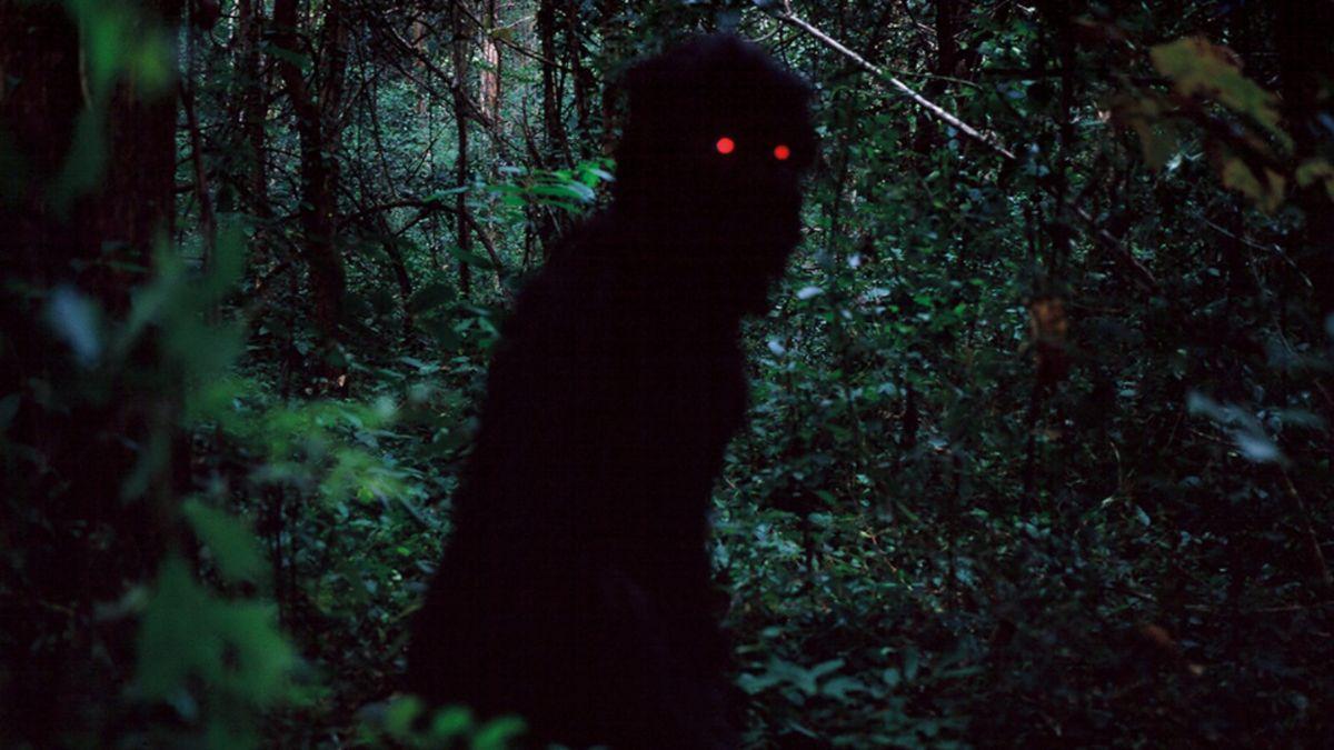 dark person in cloak with red eyes