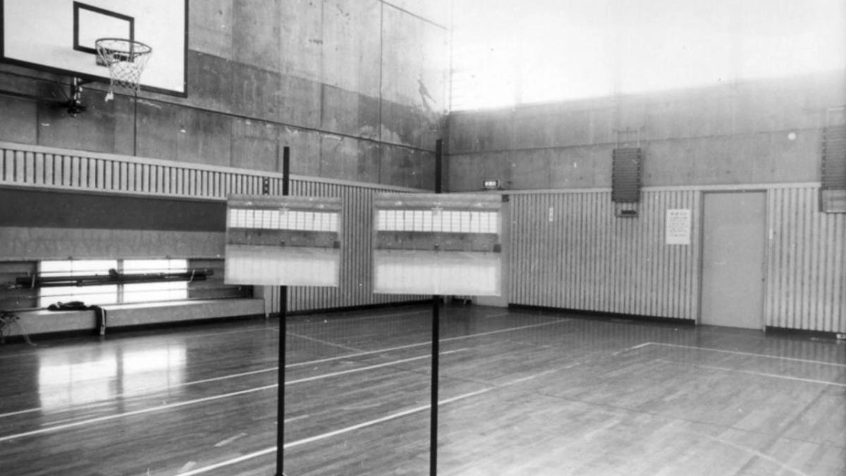 black and white basketball court with studio lights on court