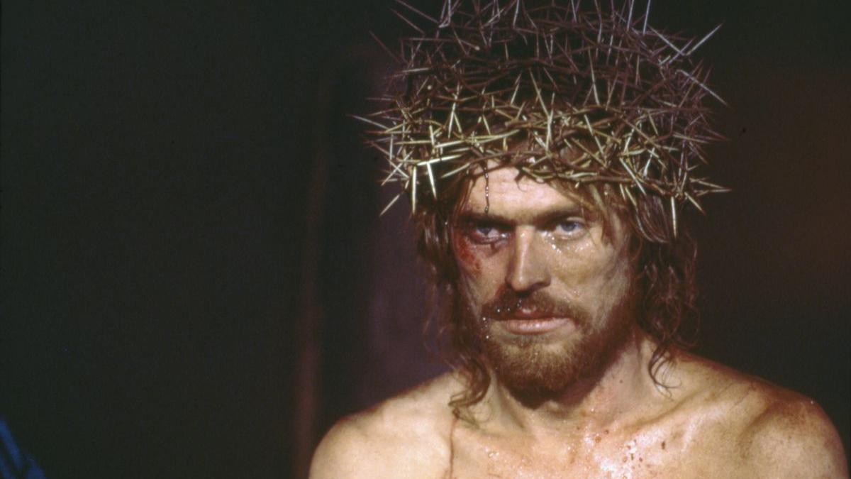 shirtless man with bleeding face and crown of thorns