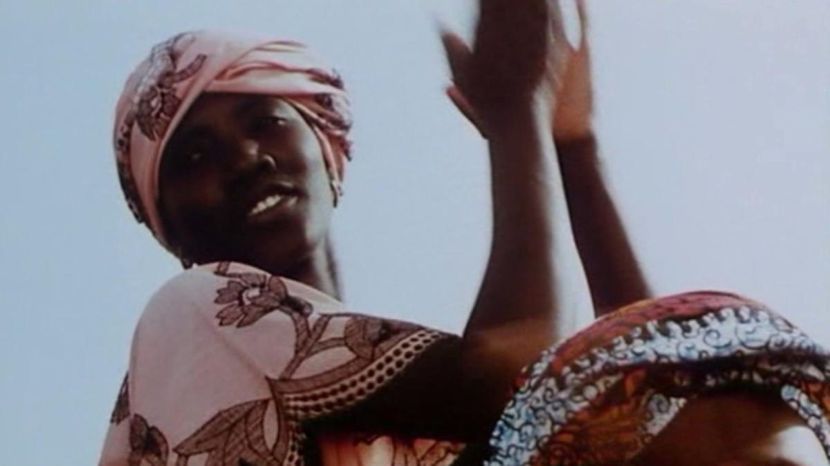 woman standing up and clapping