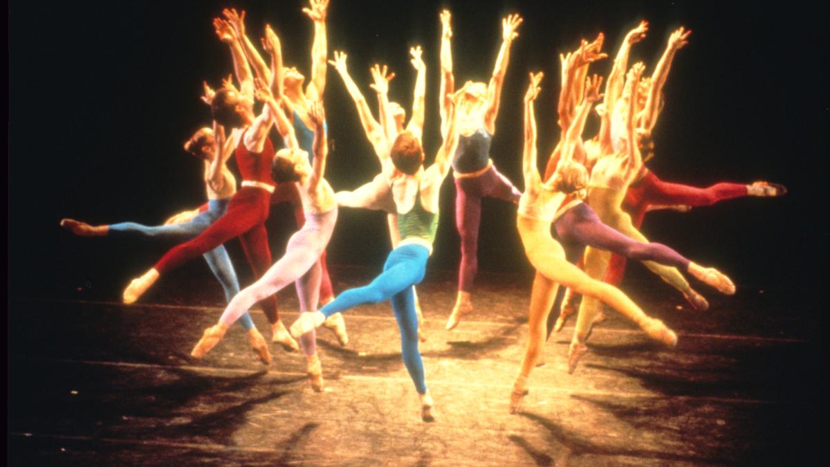 dancers on stage in leotards in circular formation