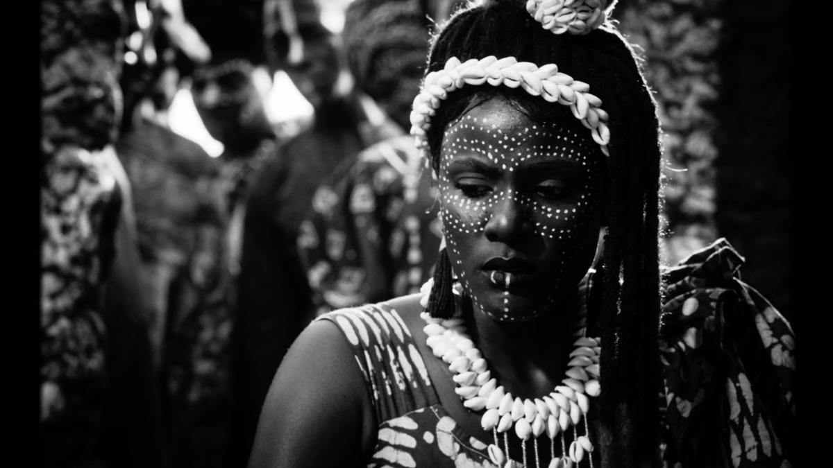 African woman with tribal jewelry and face paint