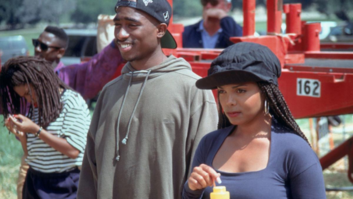 couple wearing hats looking at each other