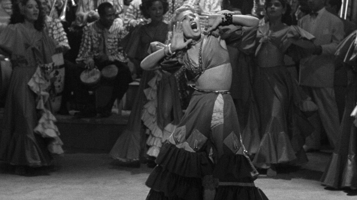 woman salsa dancing in middle of circle