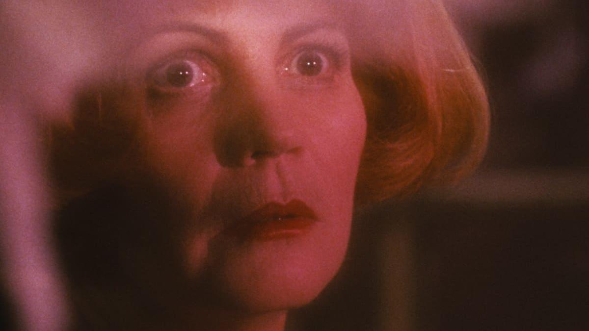 close up of blonde woman with eyes opened wide