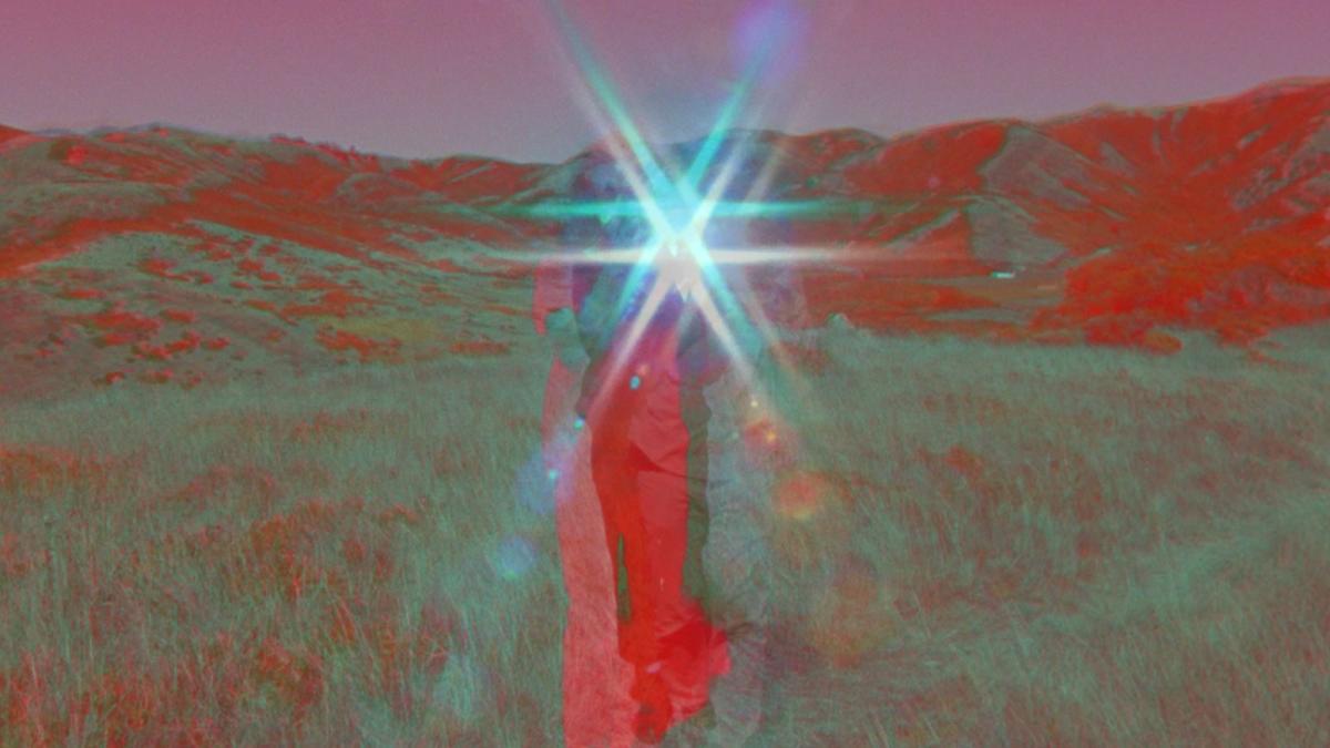 colorful image with bright light shining in center