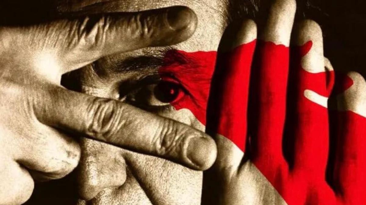 close up of man with fingers in front of face