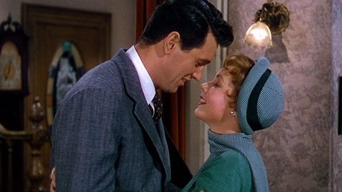 man and woman holding each other closely