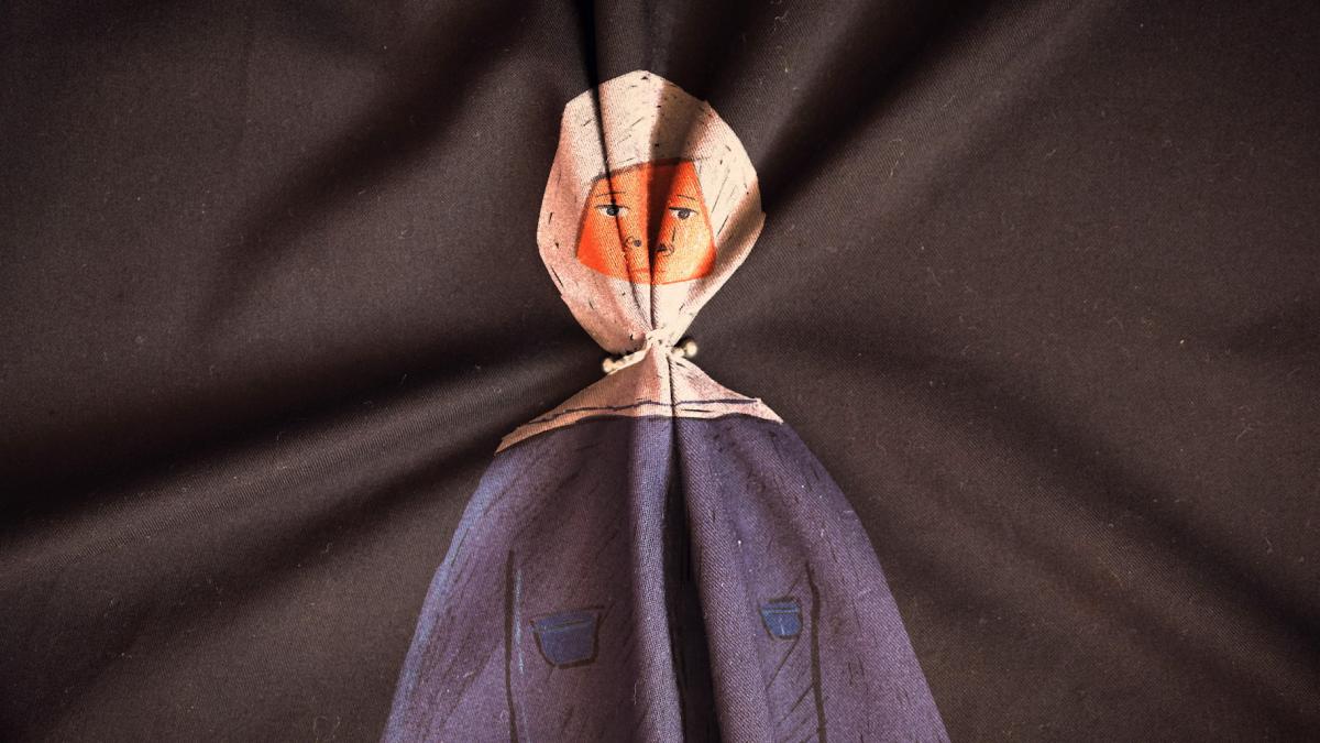 animated nun with light reflecting off of face