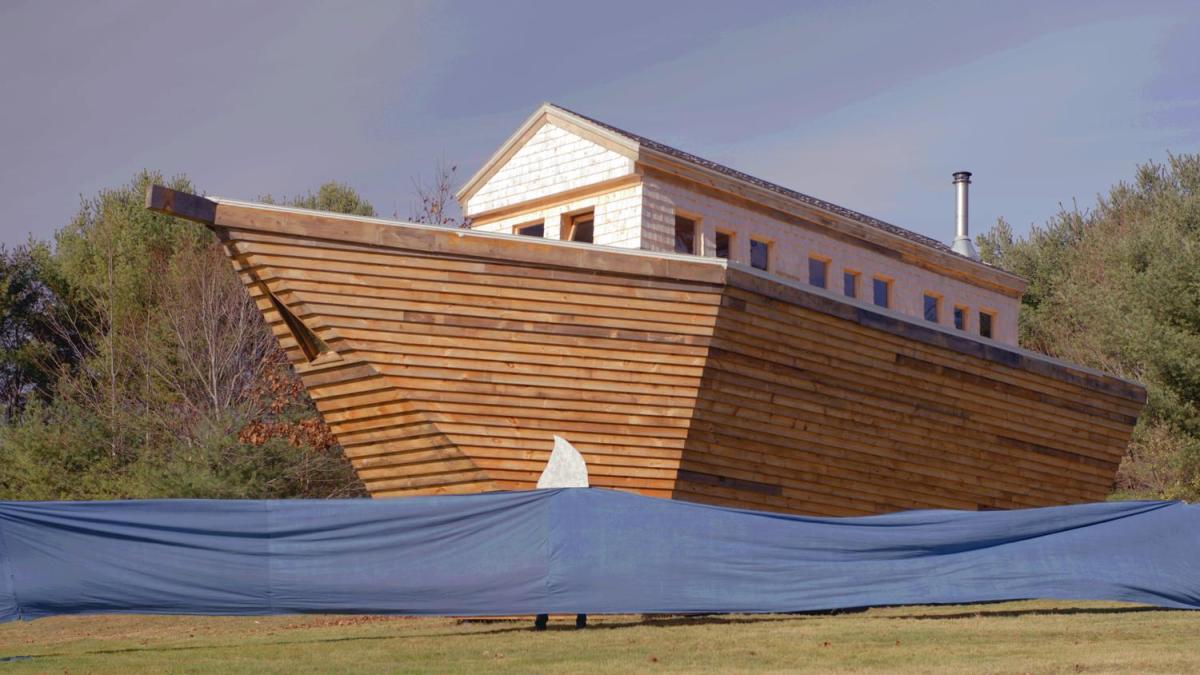 large animated arc with trees in background