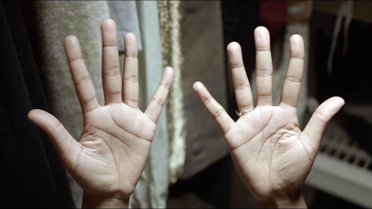 palms of two hands with fingers outstretched