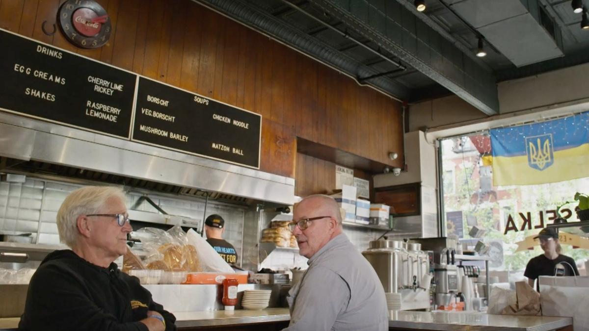 men ordering at restaurant