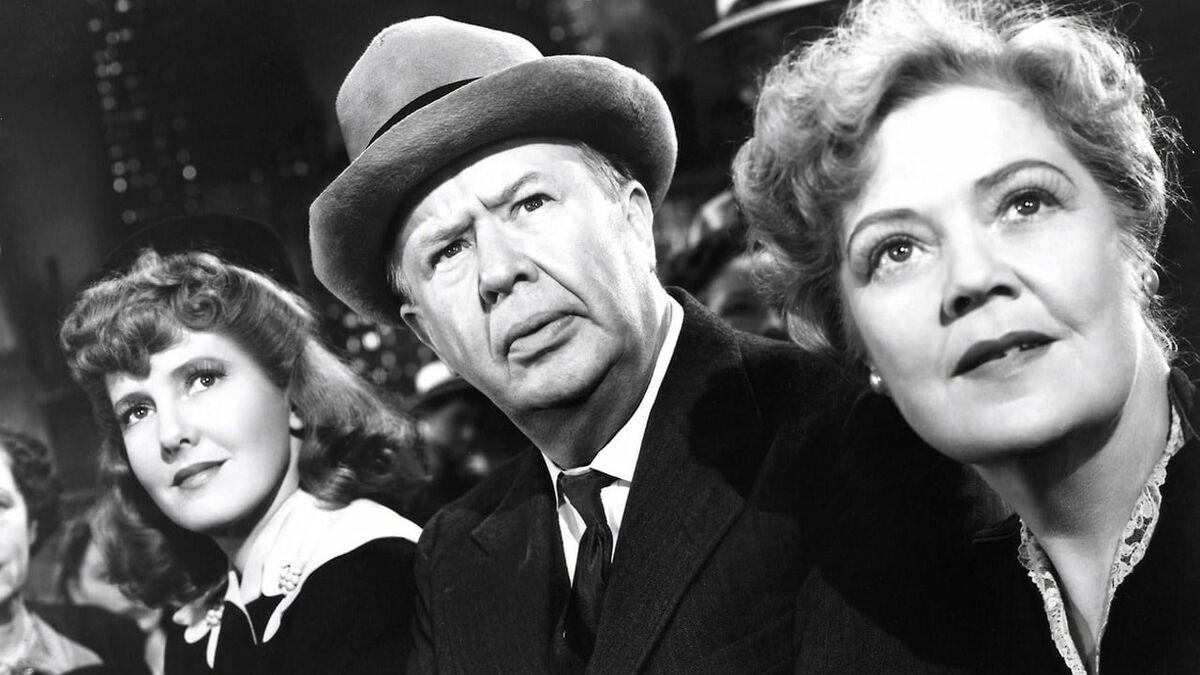 man and two women looking in distance with curiousity