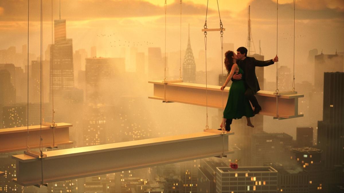 man and woman hanging off elevated beam on building