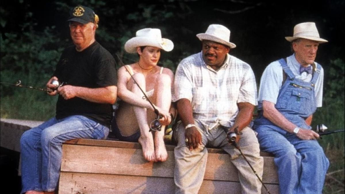 COOKIE'S FORTUNE, 1999, three men and woman sitting on bench fishing wearing overalls, flannels, and hats