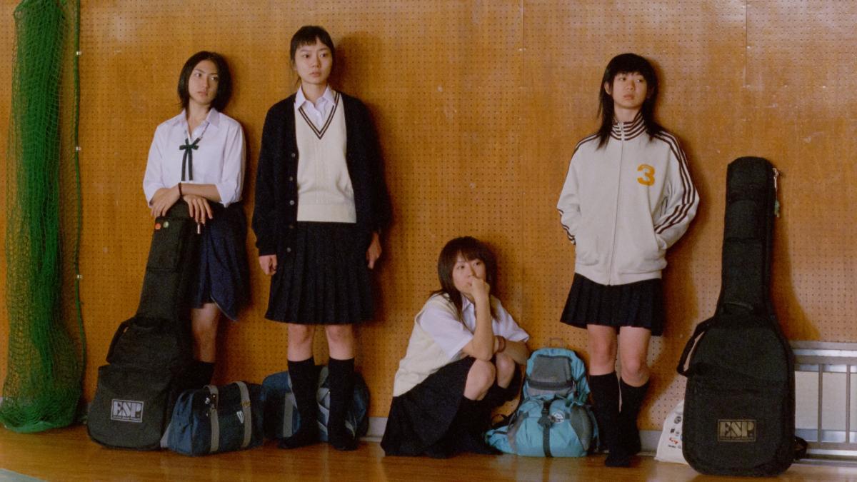 LINDA LINDA LINDA, 2005, group of four Japanese schoolgirls in uniforms leaning against wood wall