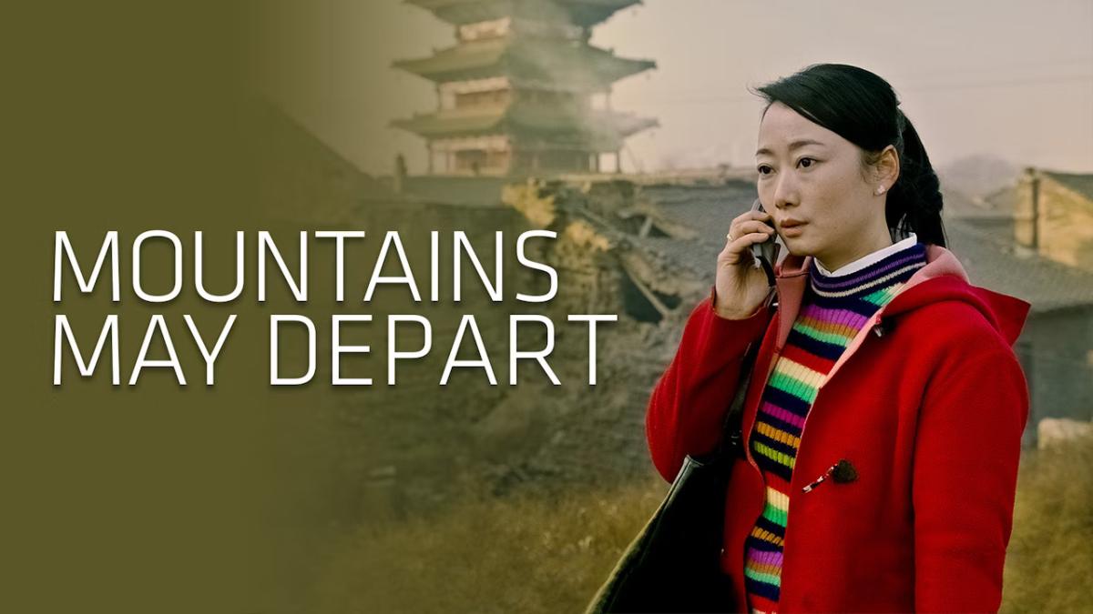 MOUNTAINS MAY DEPART, 2015, woman talking on phone in red sweatshirt outside