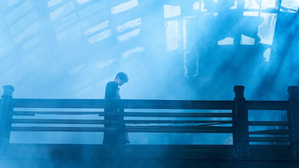 RESURRECTION, 2025, man wearing coat standing over bridge with blue lighting above and around