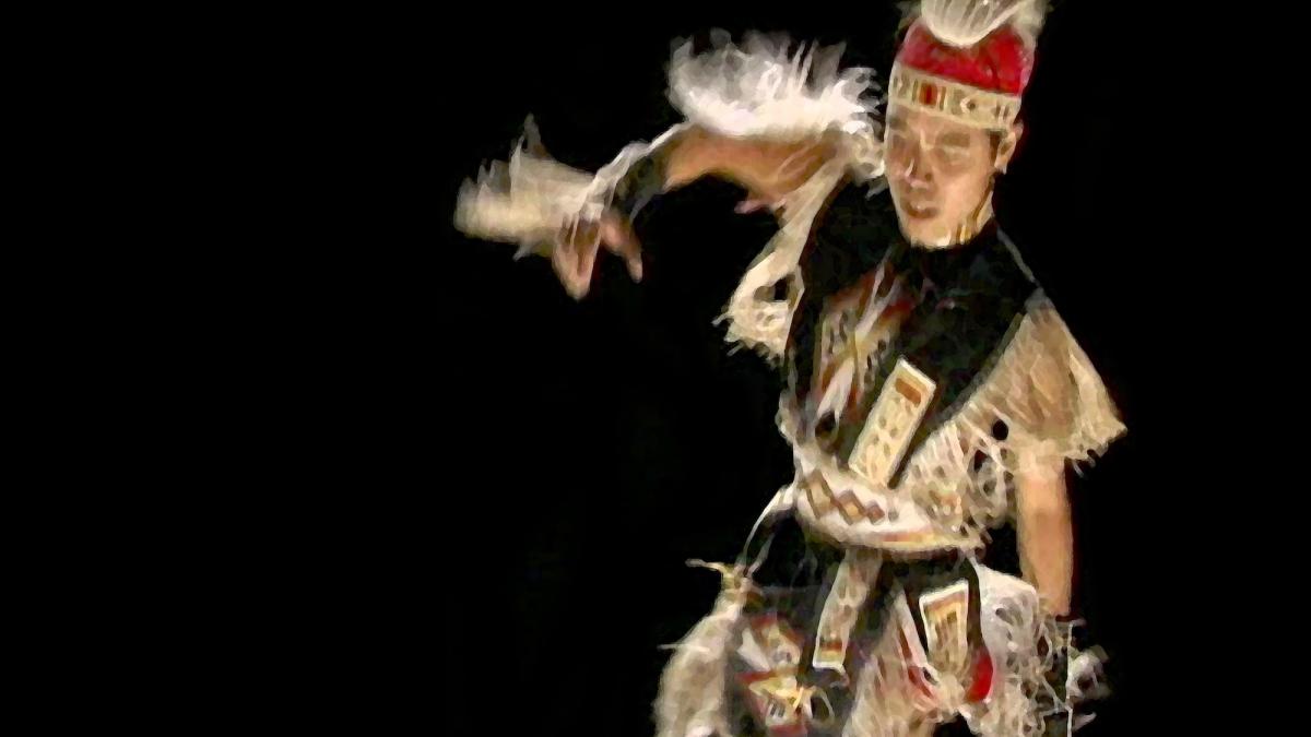 THE BUSINESS OF FANCYDANCING, 2002, man in tribal costume dancing in front of black background
