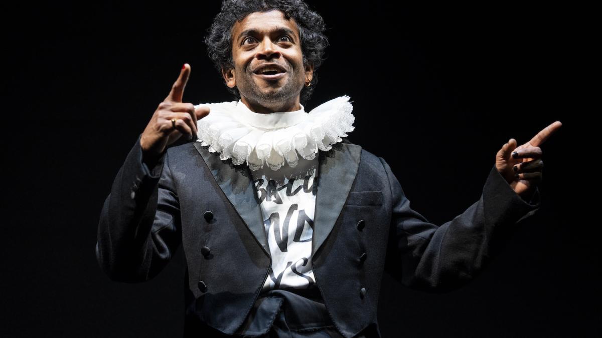 NATIONAL THEATRE LIVE HAMLET, 2026, man in black suit with white collar